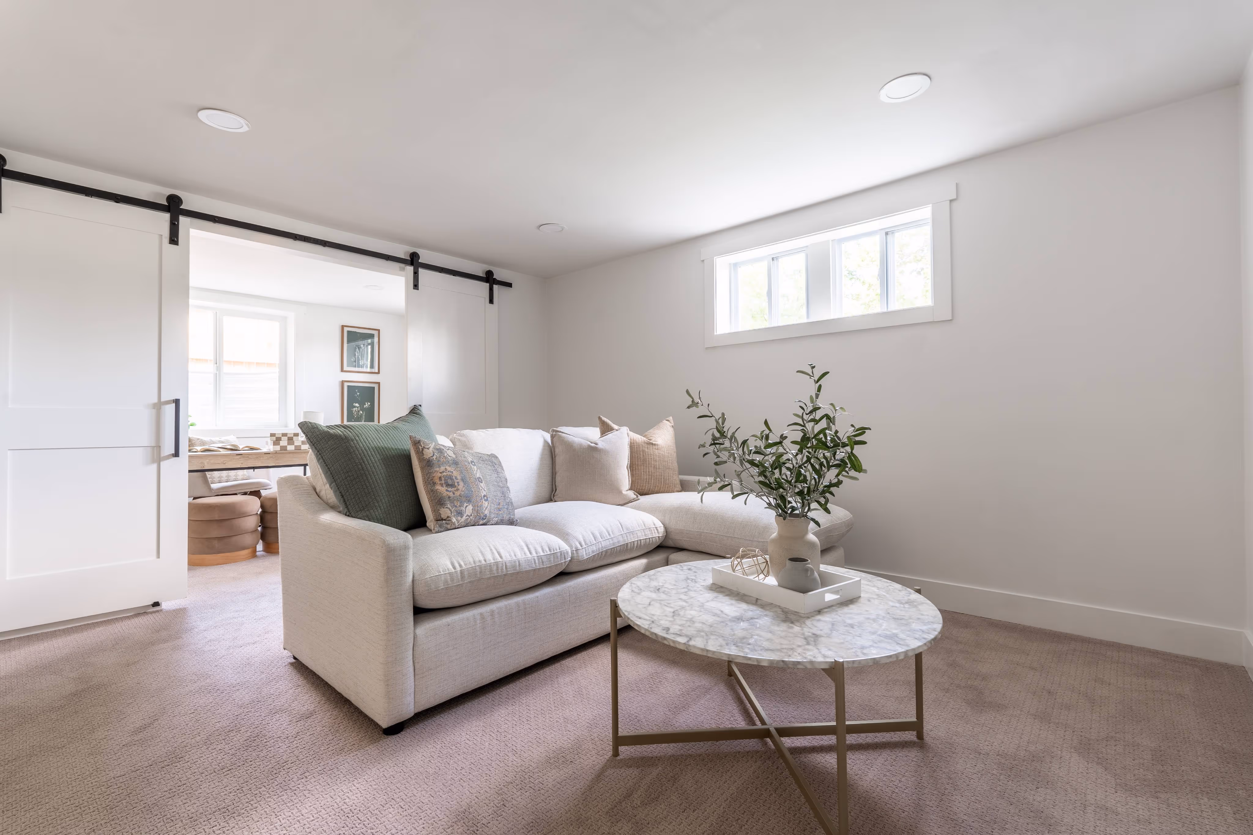Photo of a freshly remodeled living room with updated furnishings and finishes.