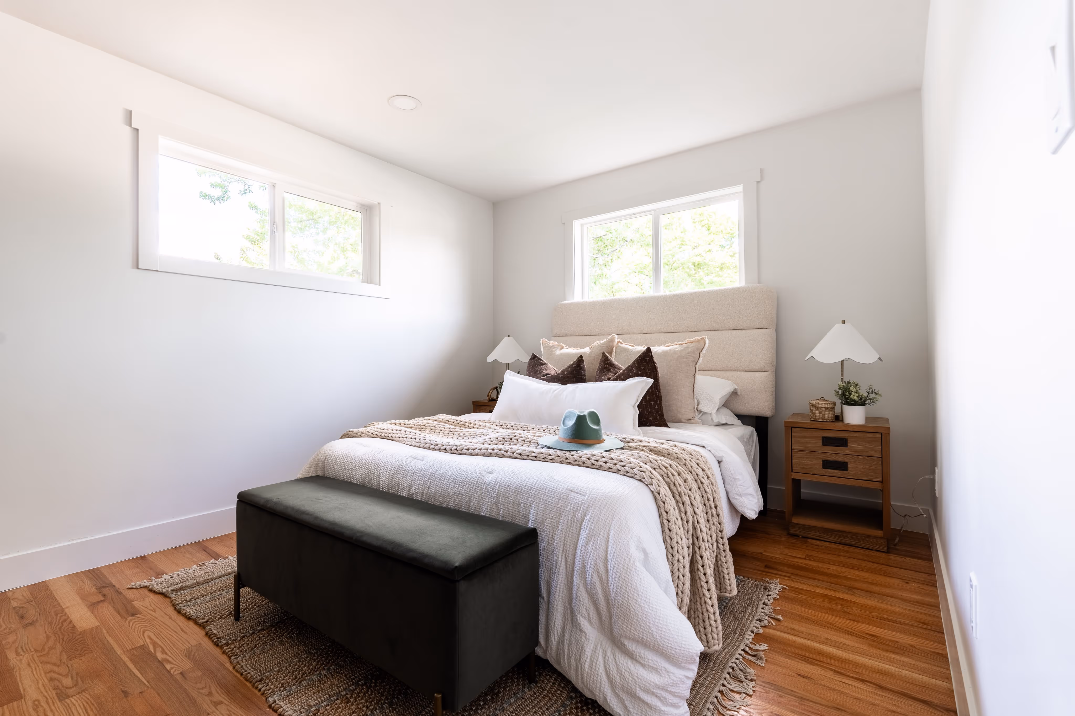 Photo of a freshly remodeled primary room with updated furnishings and finishes.