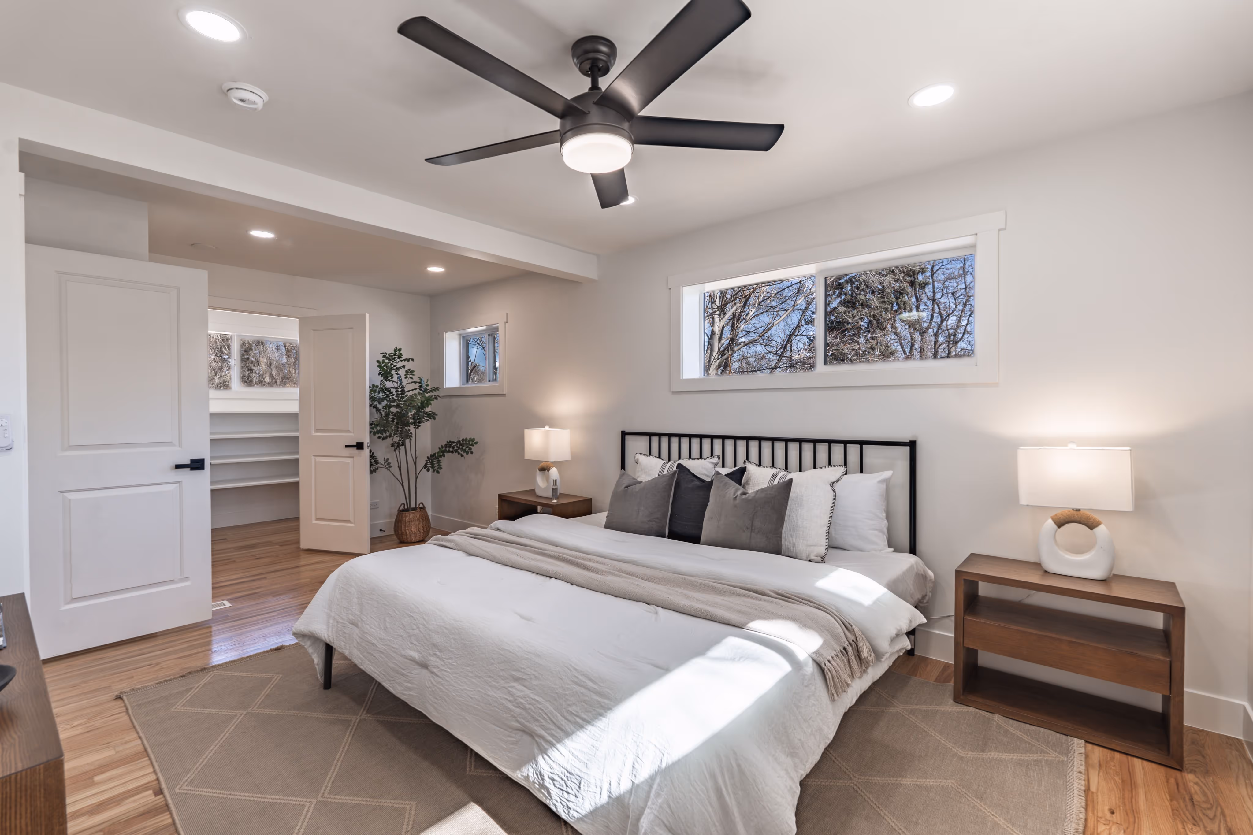 Photo of a freshly remodeled primary room with updated furnishings and finishes.