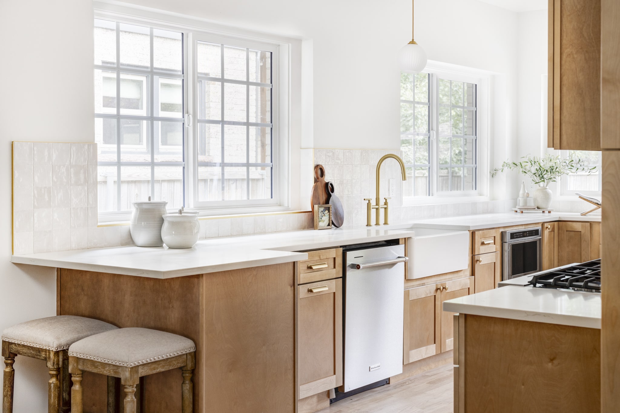 Photo of a freshly remodeled kitchen with updated furnishings and finishes.