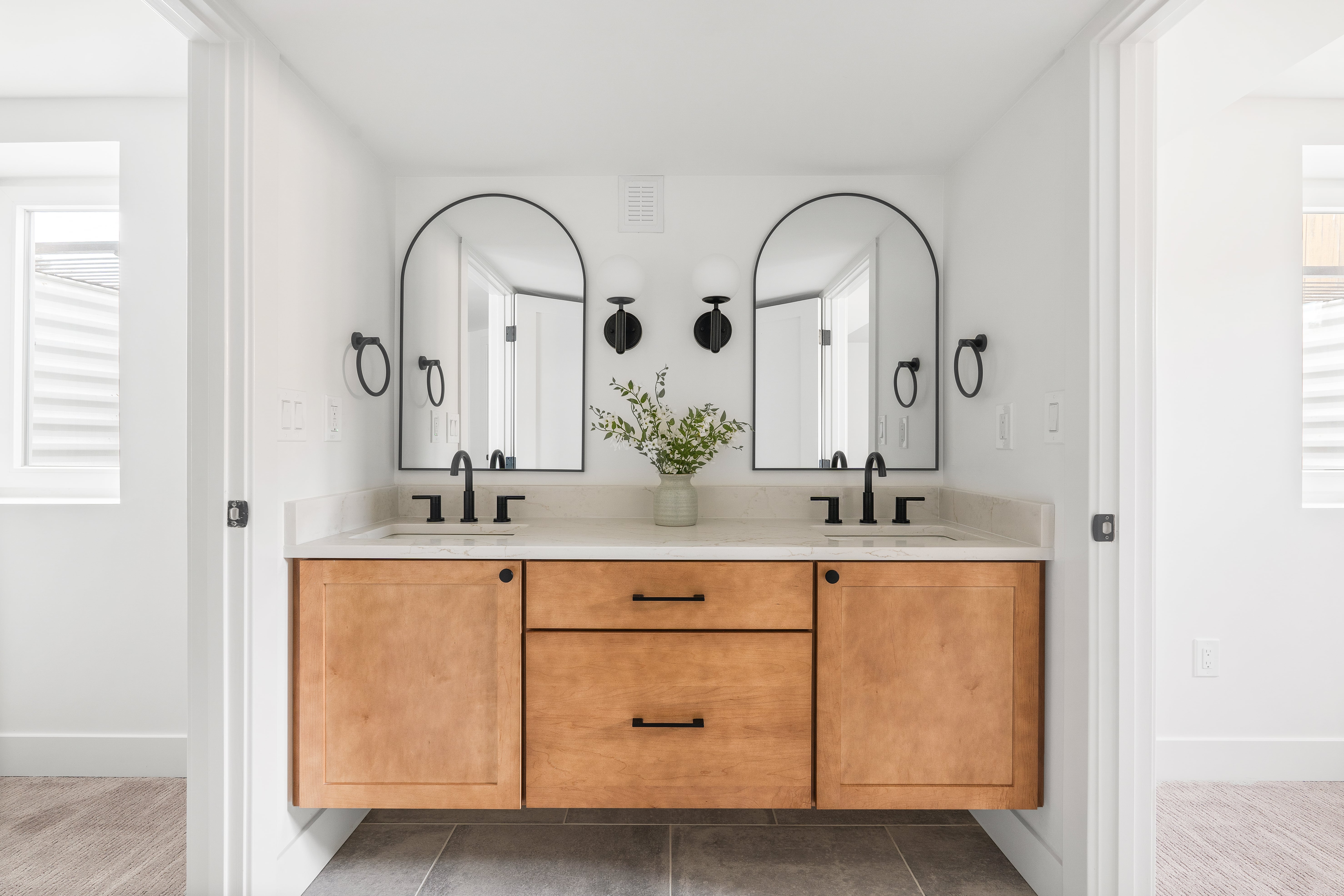 Photo of a freshly remodeled bathroom with updated furnishings and finishes.