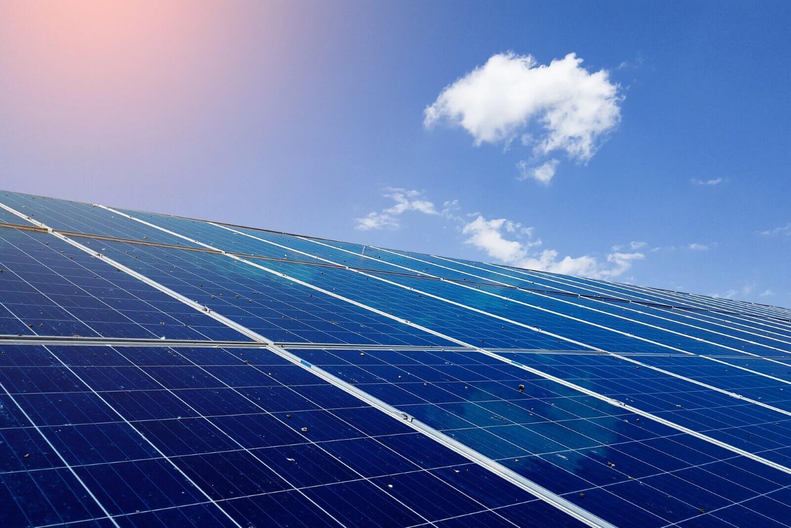 A power and renewable energy photo collage featuring solar panels, windmills, and nature shots. 