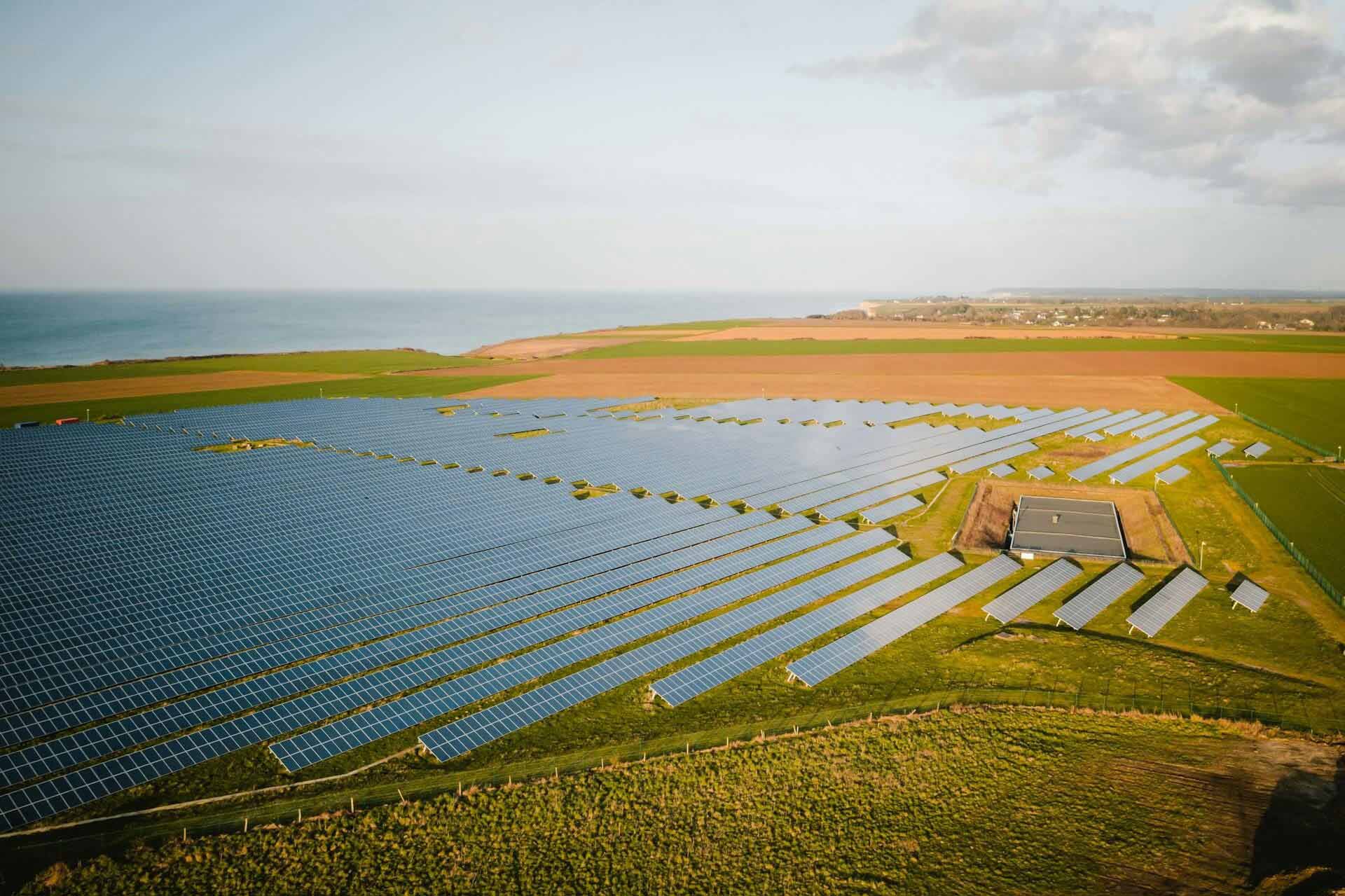A power and renewable energy photo collage featuring solar panels, windmills, and nature shots.