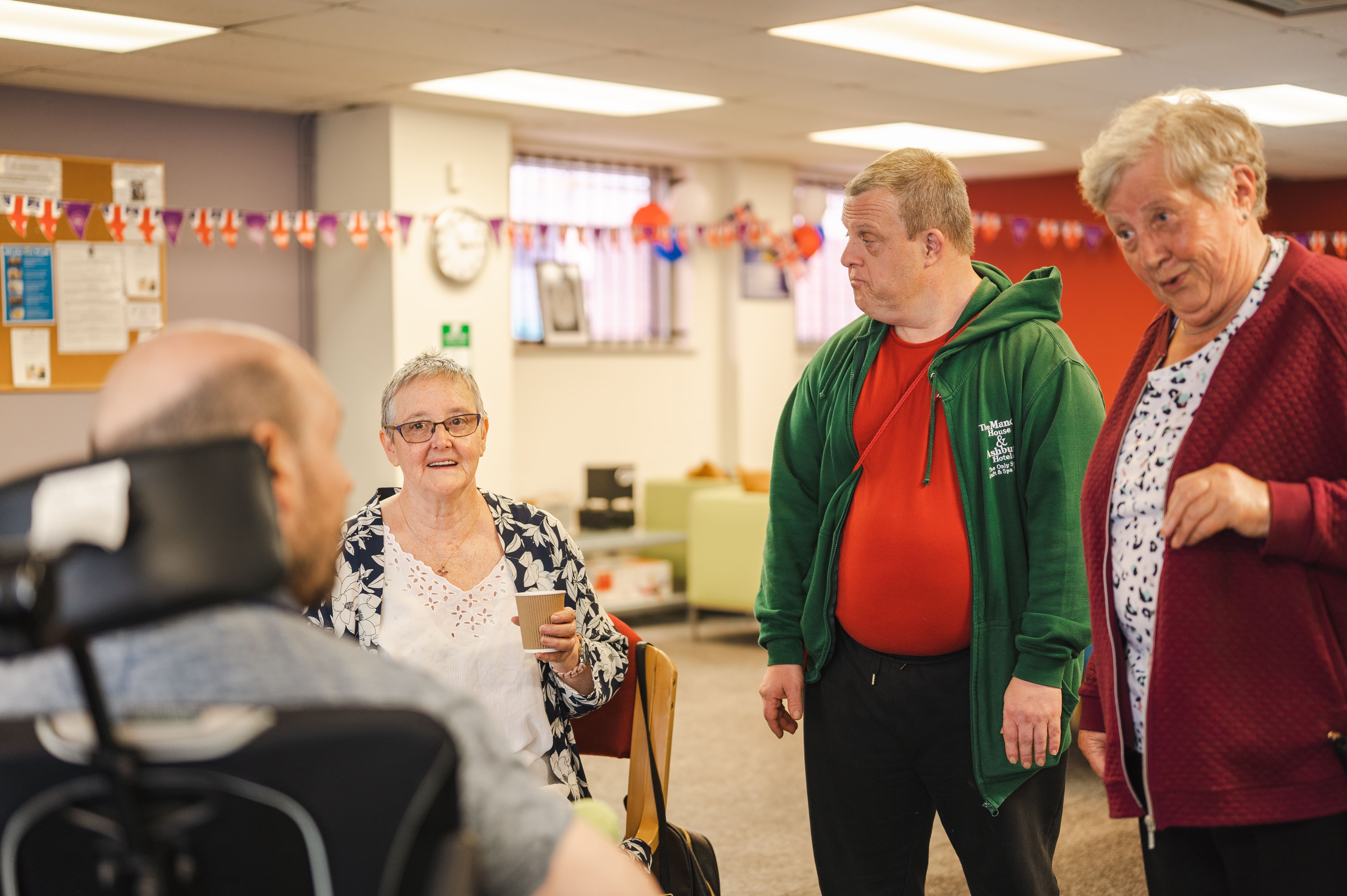 Four older people in a community setting