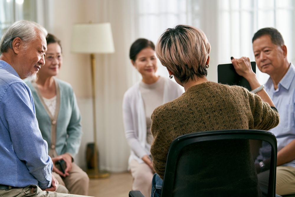 A discussion session with a group of older people