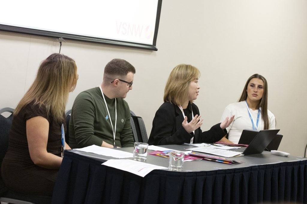 Four people participating in discusion
