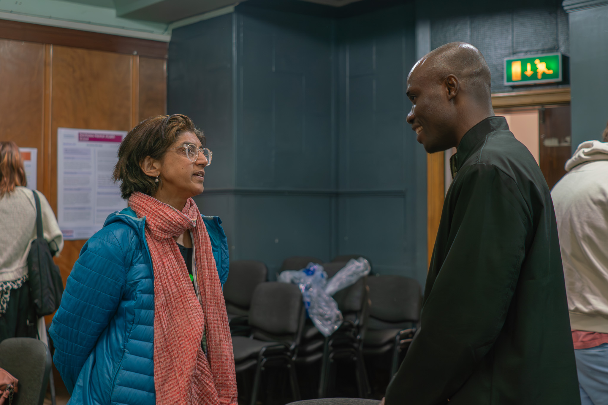 Two people chatting at a conference