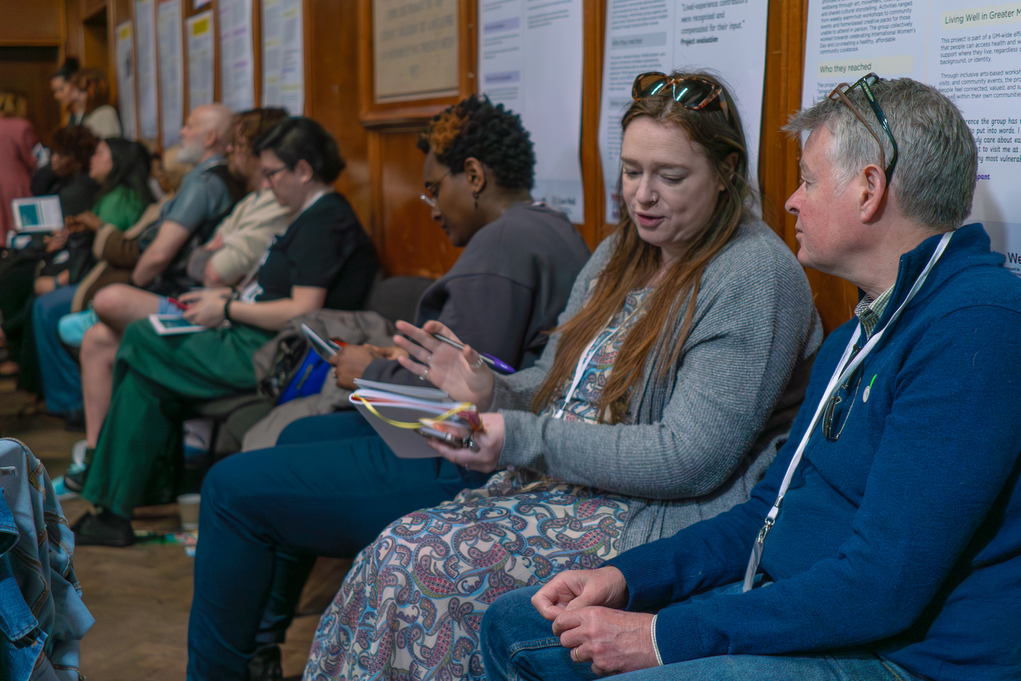People seated, chatting at a conference