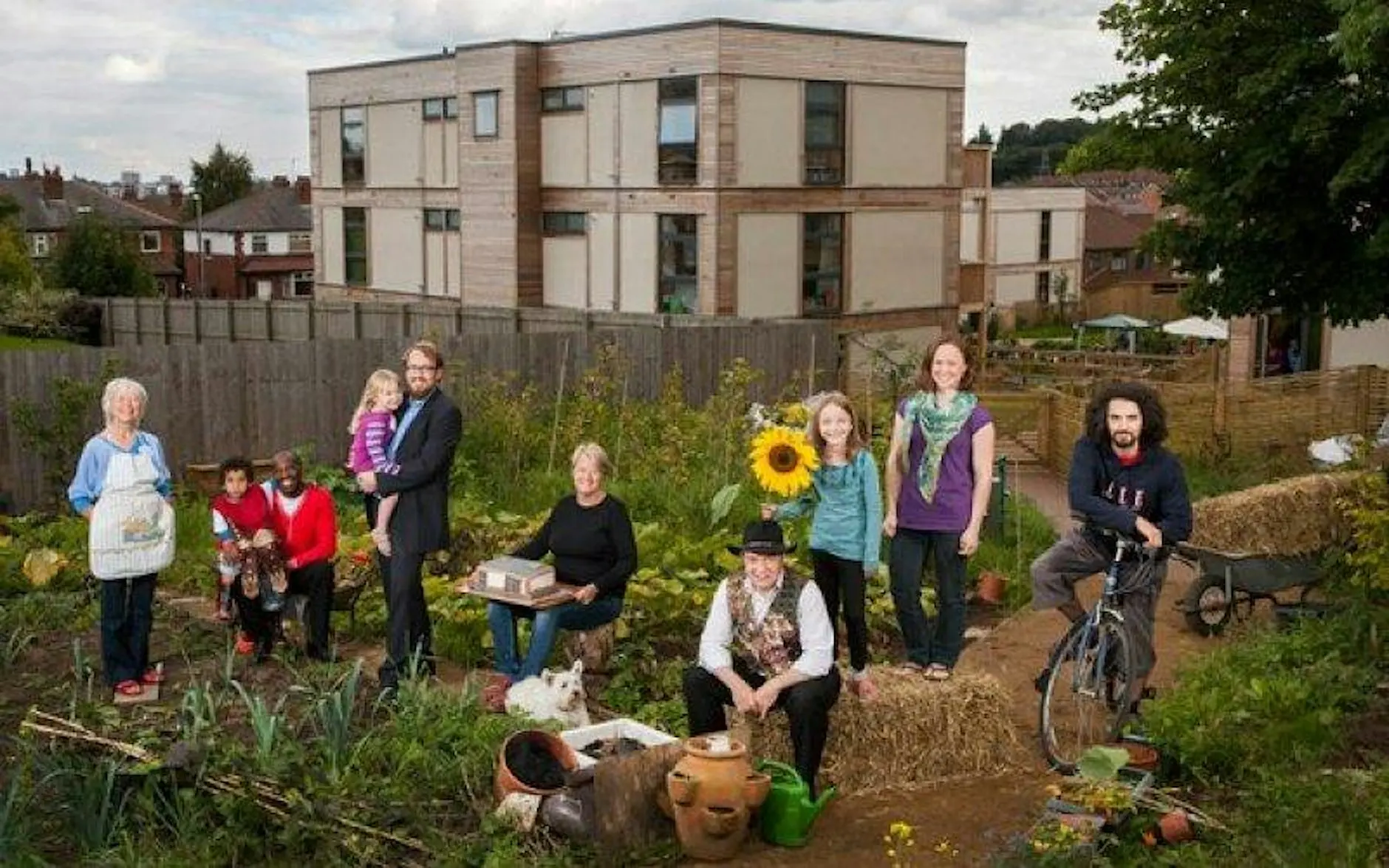 A range of people and ages in a community garden