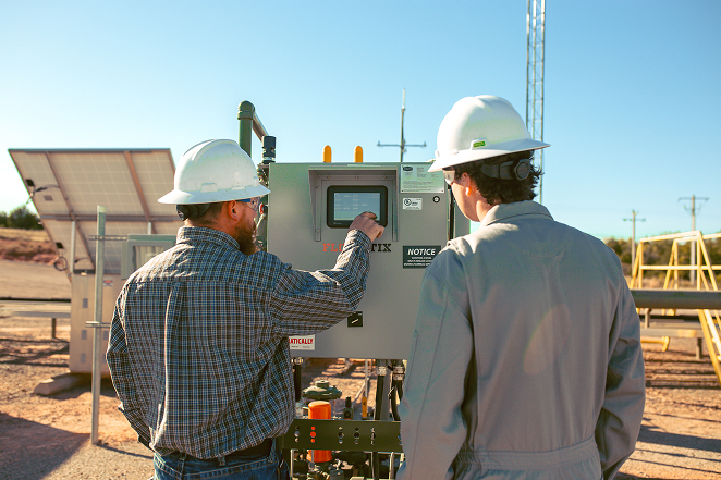 Flogistix technicians operating PLC