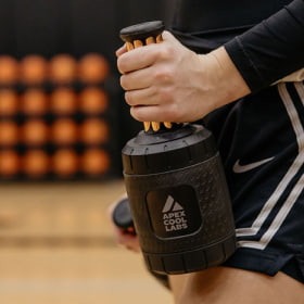 Close up of a basketball player holding a palm cooling device called the Narwhals