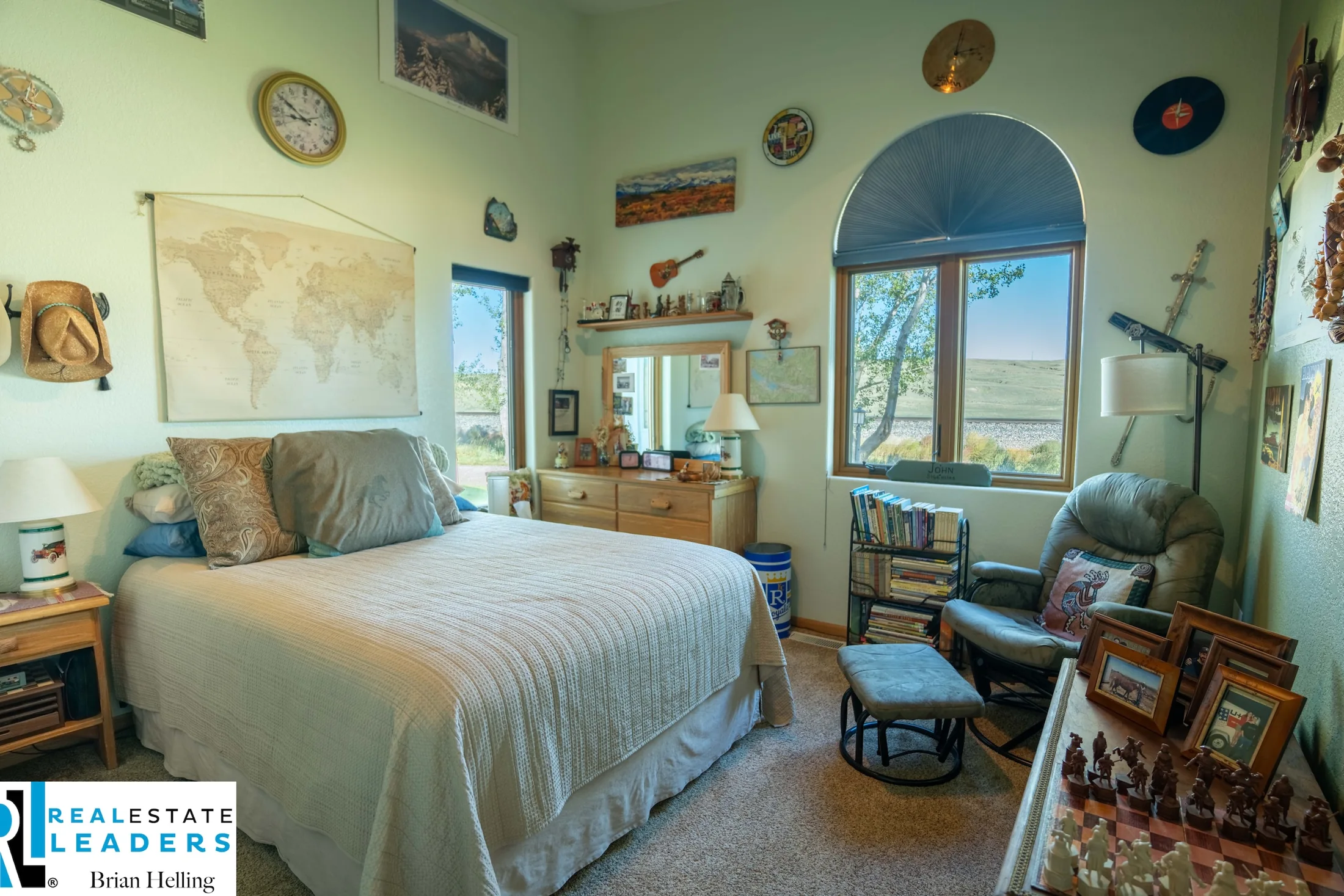 Bedroom with an arched window and garden views