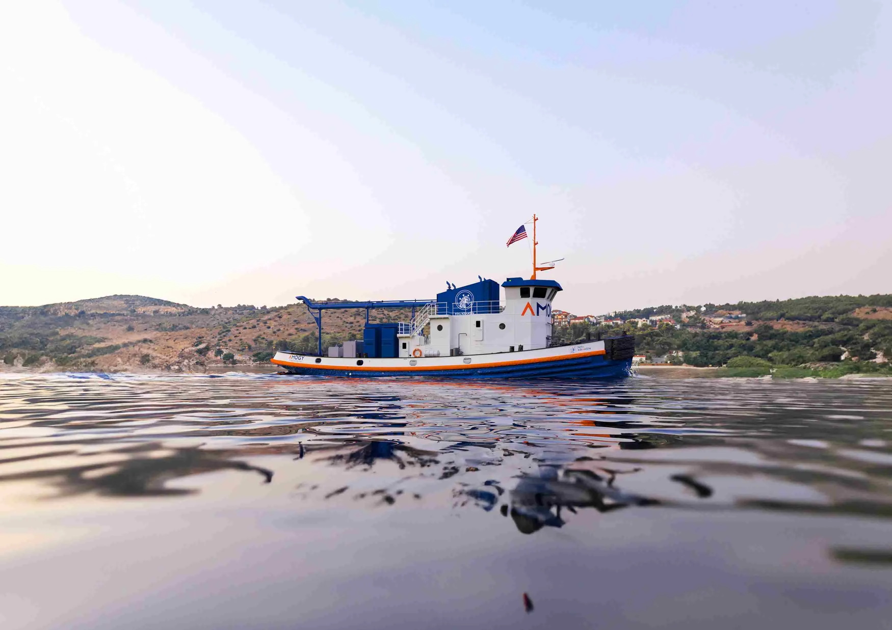 The NH3 Kraken is a tugboat retrofitted with the New York based start-up, Amogy's innovative ammonia-to-electrical power system which emits zero carbon. The tugboat, originally built in 1957, was initially powered by diesel generators and electric motors. The NH3 Kraken embarked on its maiden voyage along an inland waterway in New York in 2024, demonstrating a promising pathway to reduce emissions in the maritime sector. 