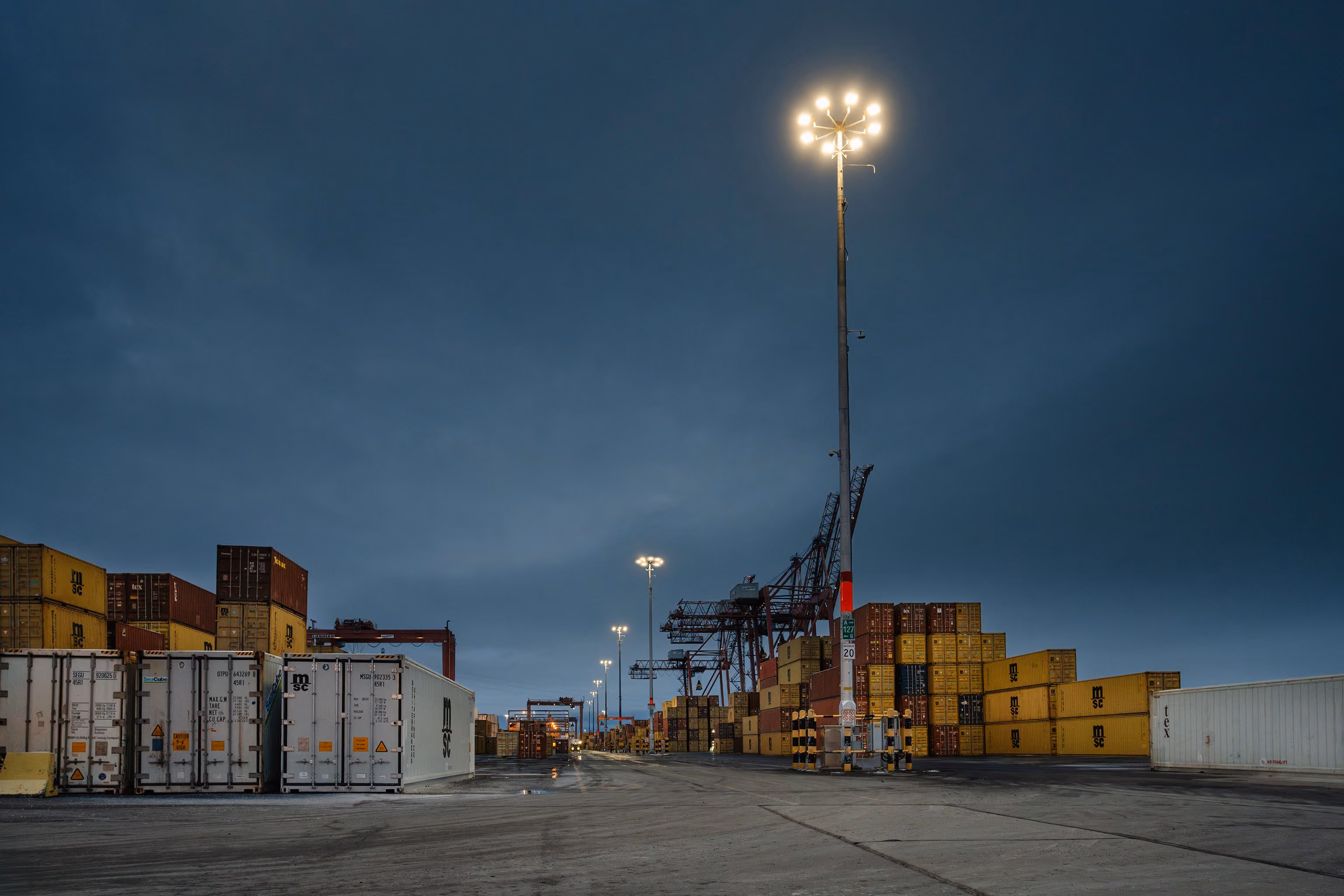 Terminal operator Termont upgraded the outdoor lighting system at the Port of Montréal’s Maisonneuve Terminal to improve safety, reliability, and environmental performance. Developed with Concept Illumination, the LED retrofit reduces energy consumption by more than 80%, lowers maintenance needs, and minimizes light pollution by placing the new luminaires parallel to the ground, reducing glare and focusing illumination on work areas. The project was completed in four weeks with minimal disruption to terminal operations and demonstrates how smart lighting technologies can enhance efficiency and sustainability in active port environments.
