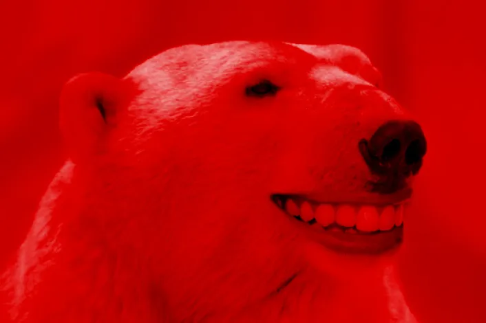 A polar bear with a human-like grin representing inspiration and invention