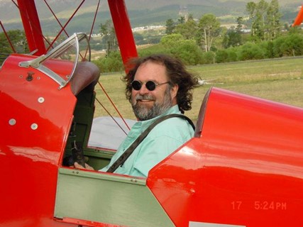 A person in a red plane

AI-generated content may be incorrect.