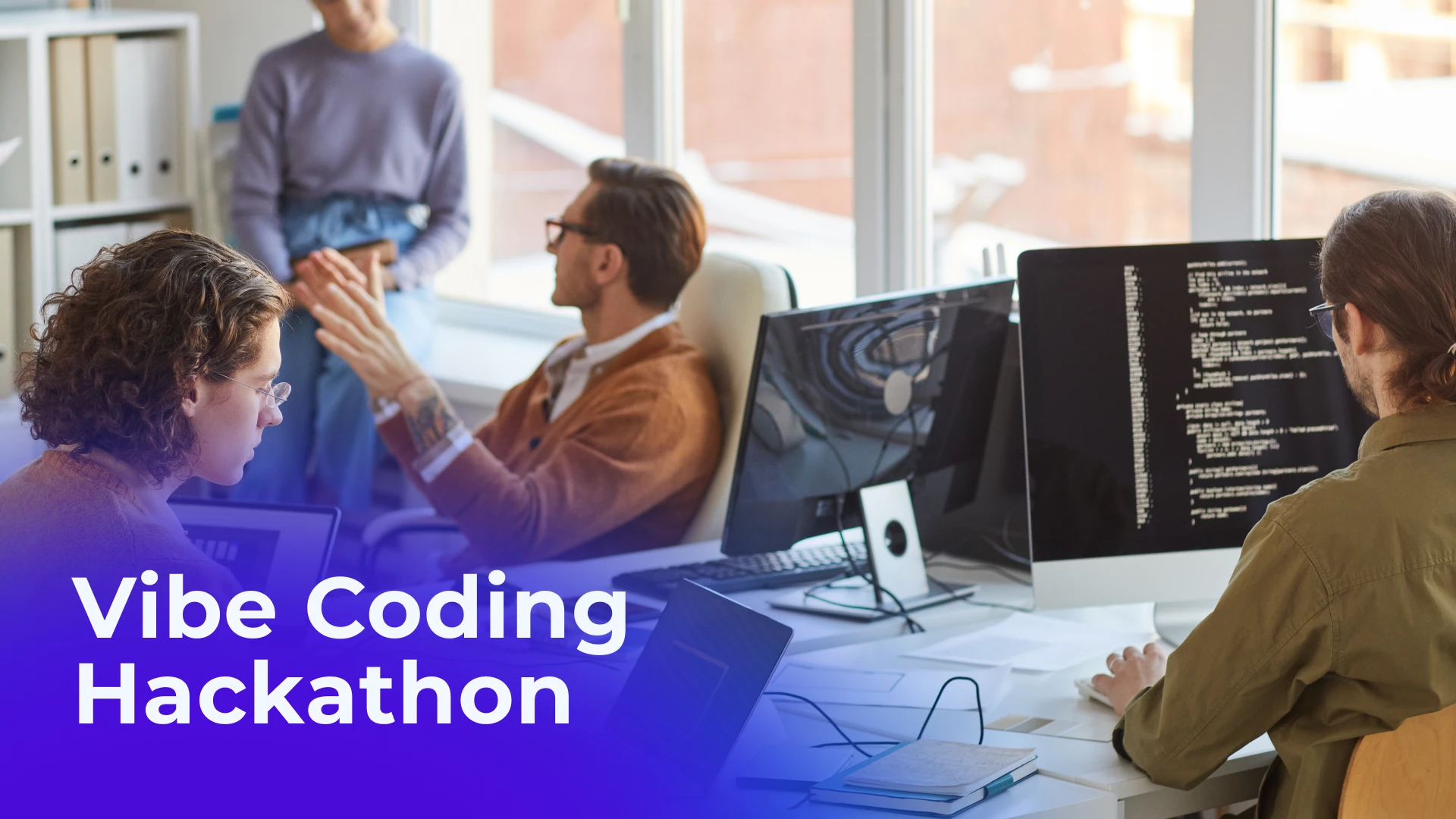 a photo of people at a hackathon working together in a university