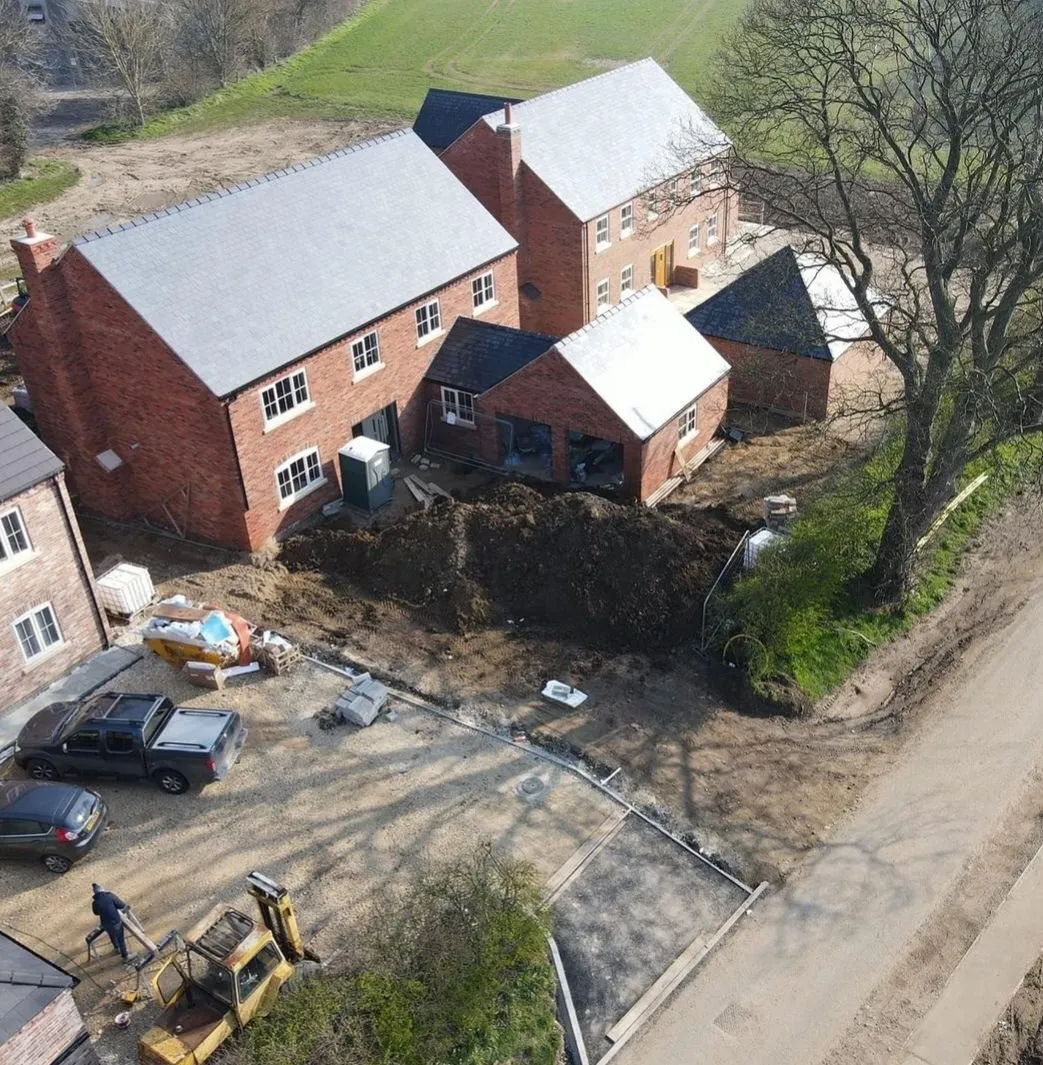 Ariel view of a house nearing completion.