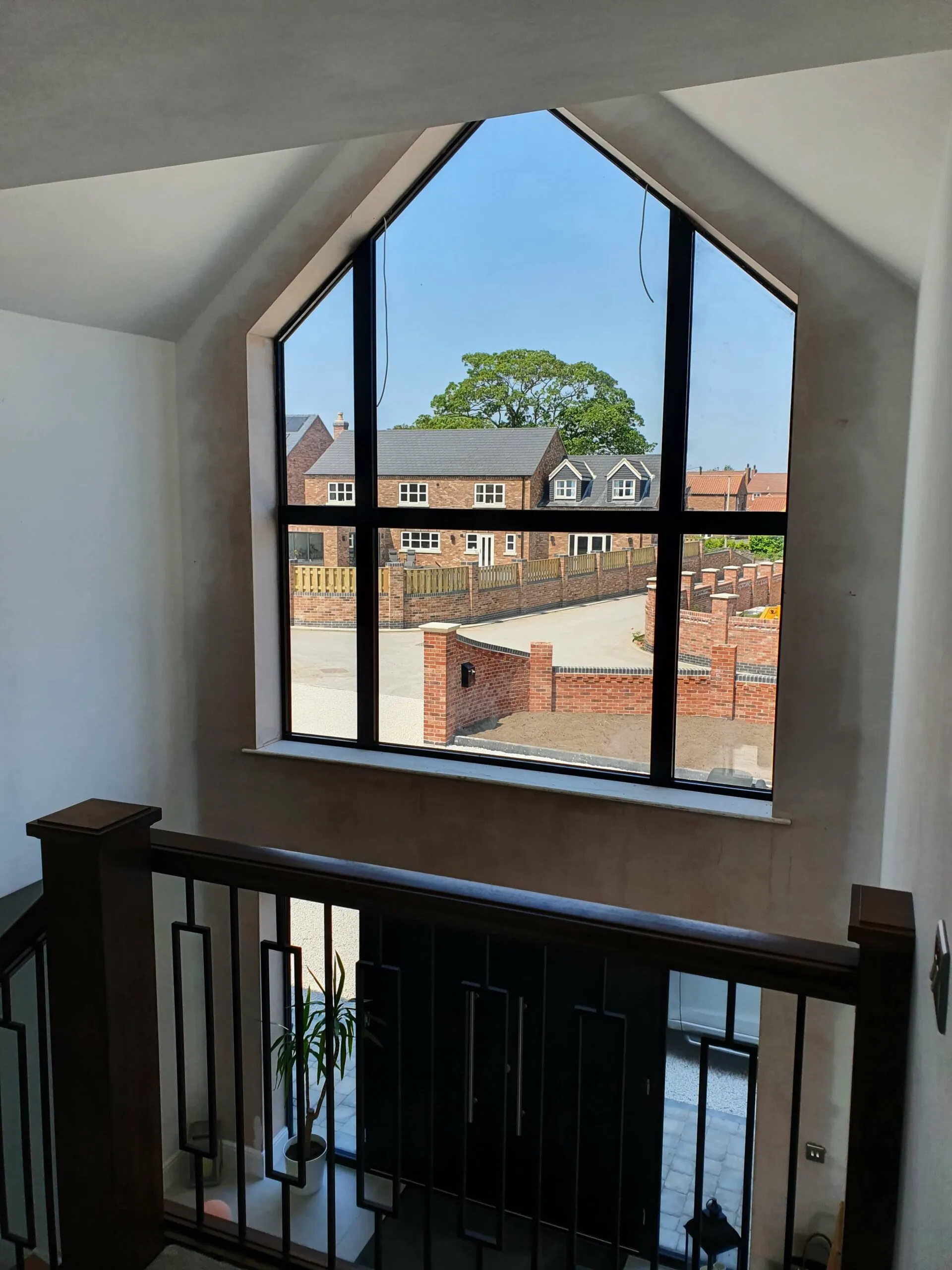 A view of a house from a window.