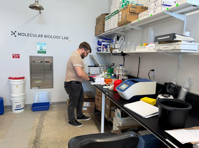 QBI scientist Brian Ross performing an experiment at the Molecular Biology Lab, one of QBI’s labs within its headquarters in Los Angeles, Calif. 
