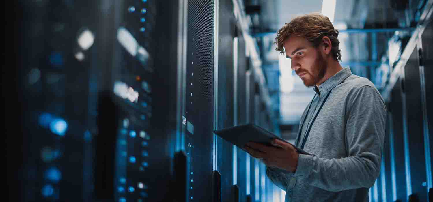 IT professional setting up secure cloud infrastructure in a modern data center