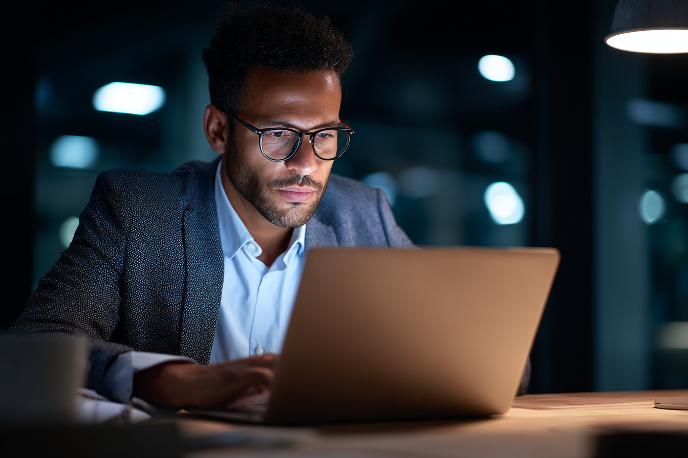 employee accessing sensitive personal data on laptop