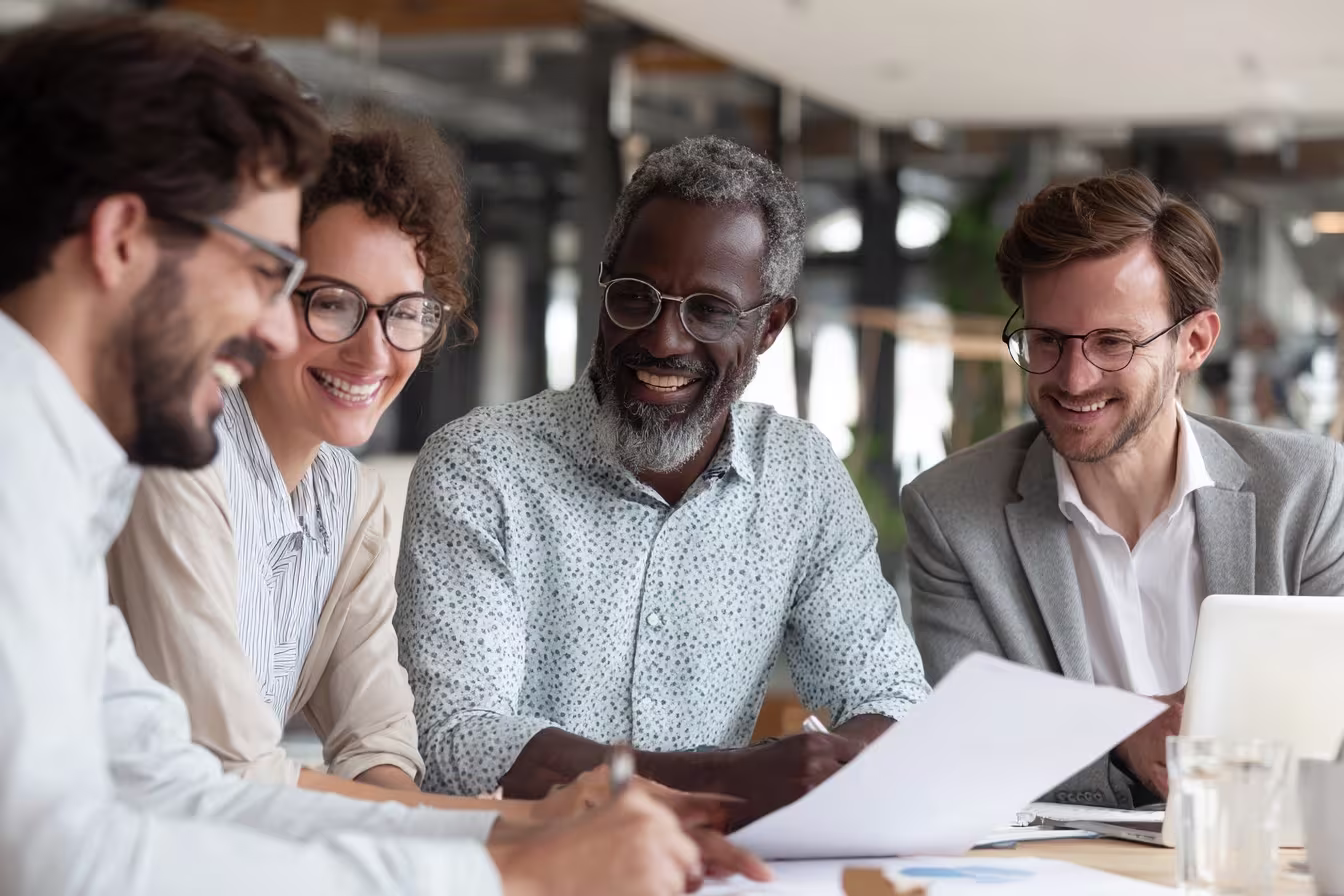 Professionals reviewing SOC report together
