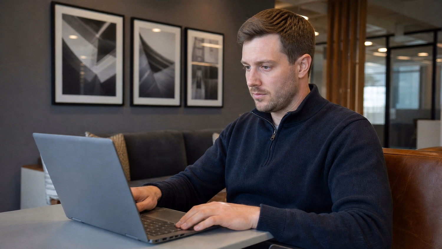 LOUNGE AREA LAPTOP An IT professional  one person working on a laptop in a ca