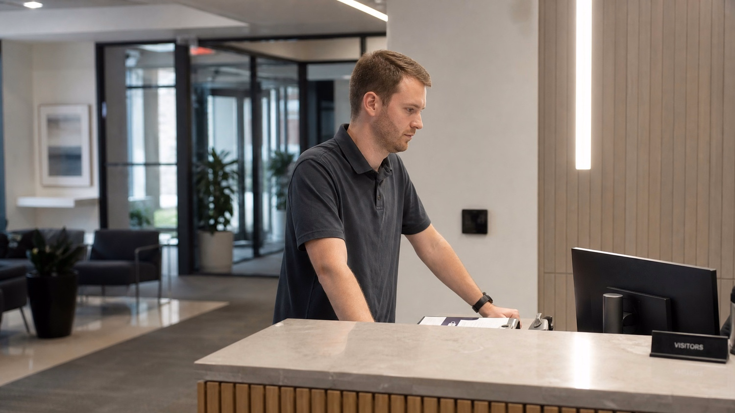 RECEPTION AREA An IT professional  one person standing at a front reception d