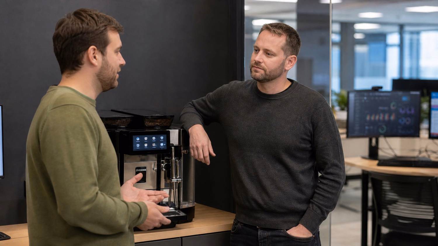 COFFEE BREAK CHAT An IT professional two people having a casual standing con