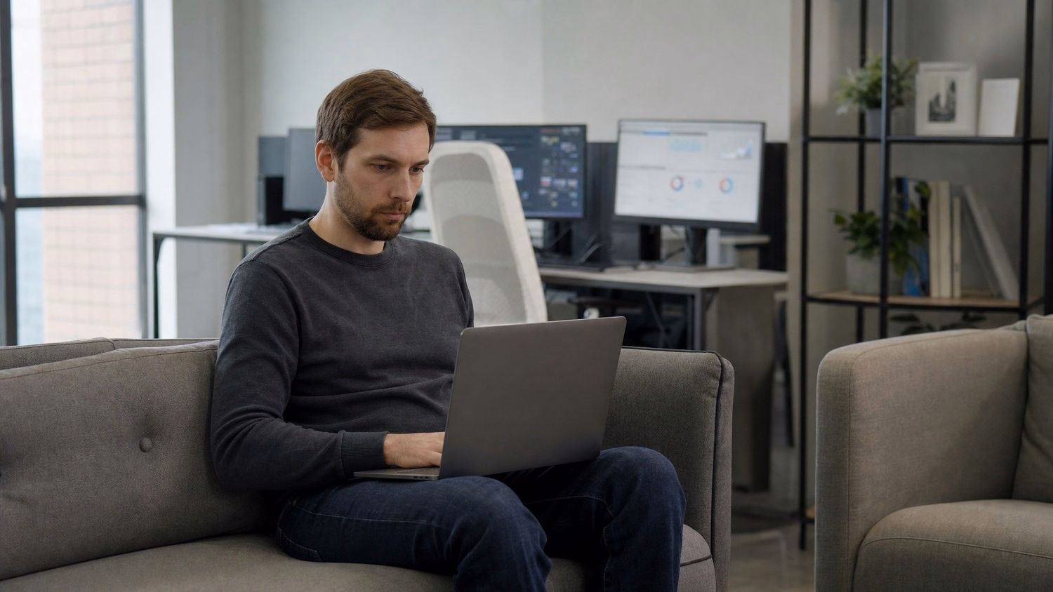 LOUNGE AREA LAPTOP An IT professional one person working on a laptop in a ca