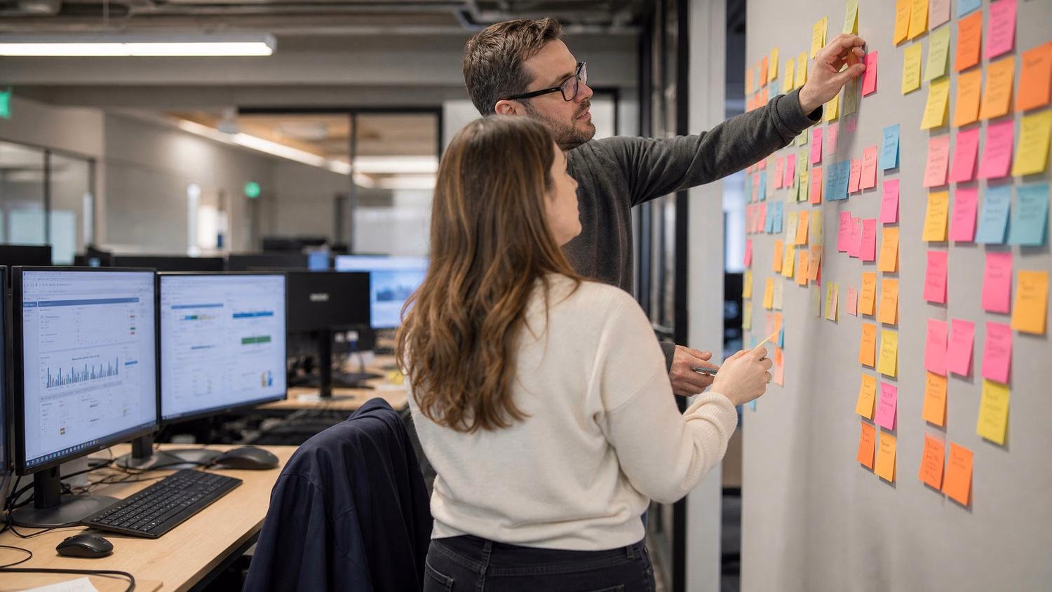 IT team brainstorming project workflows with sticky notes 55