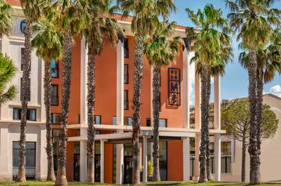 Palm trees in front of Villa M Marseille entrance.