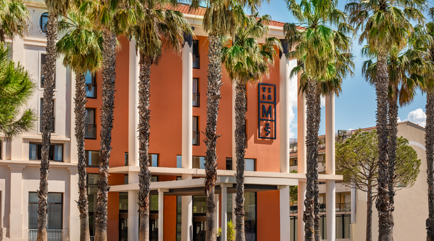 Palm trees in front of Villa M Marseille entrance.