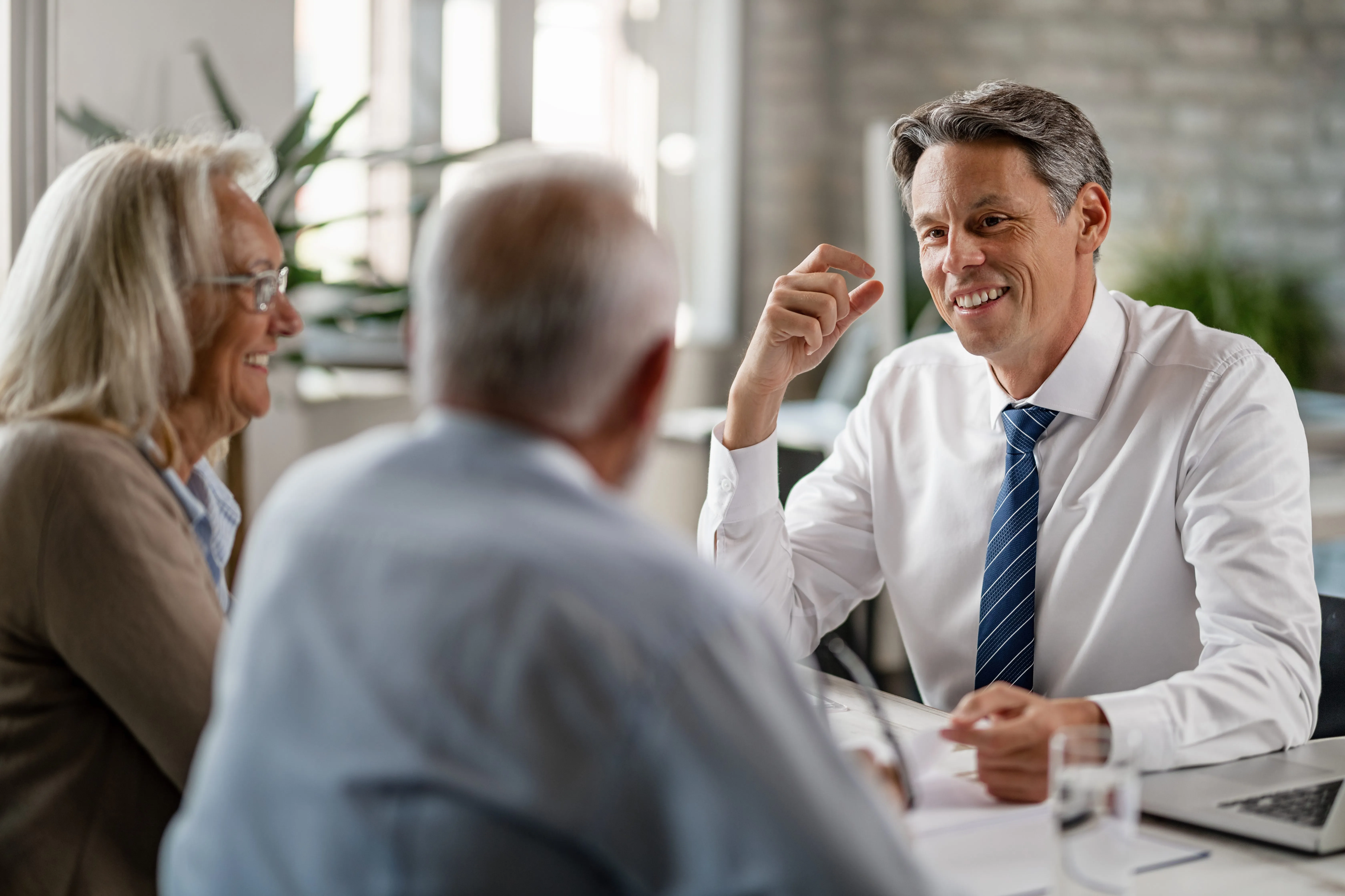 Financial advisor in consultation with clients.