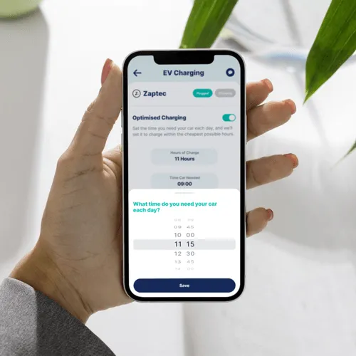 Hand holding phone showing Ostrom EV feature