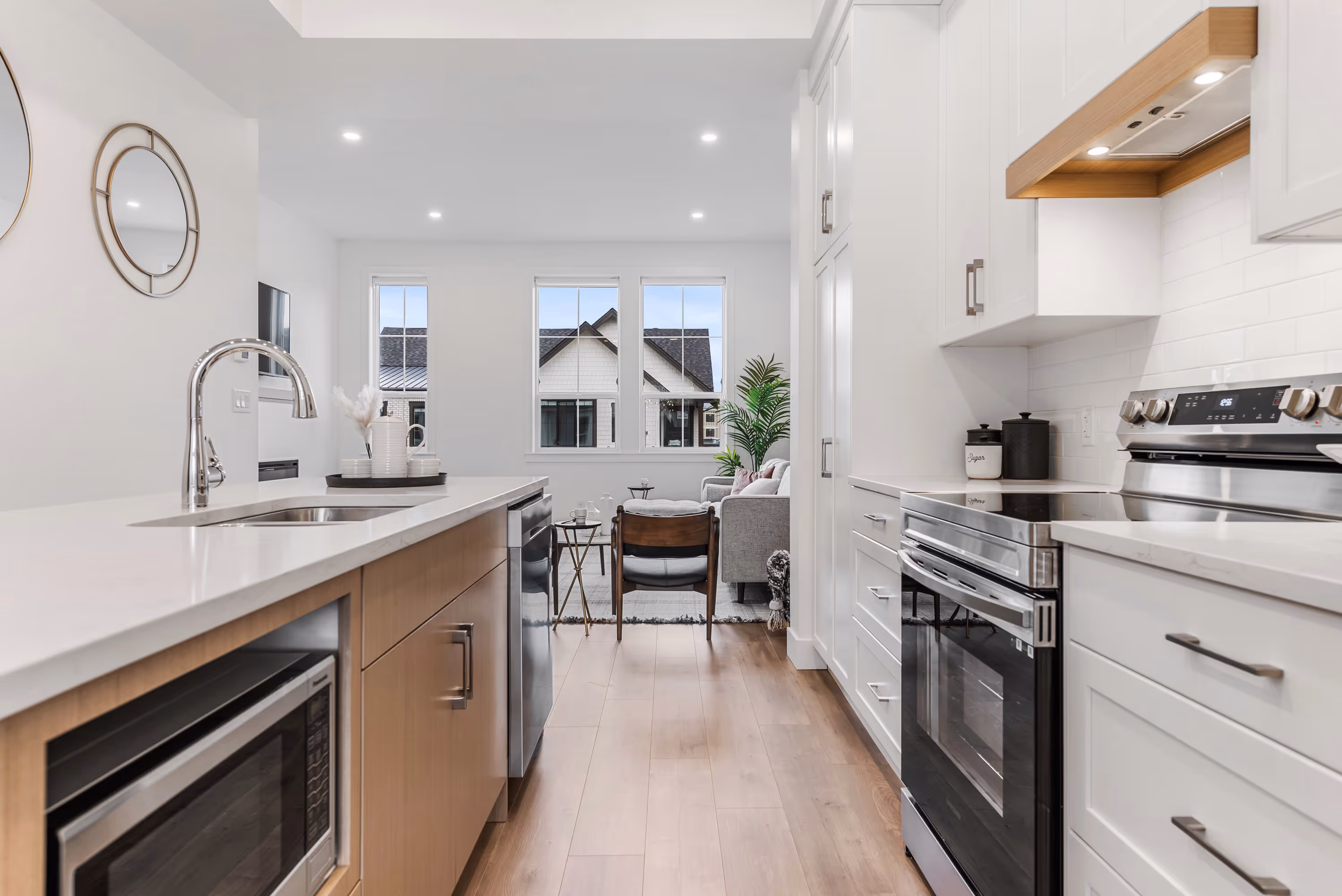 cedarbrook townhome kitchen with stainless steel appliances and light wood accents