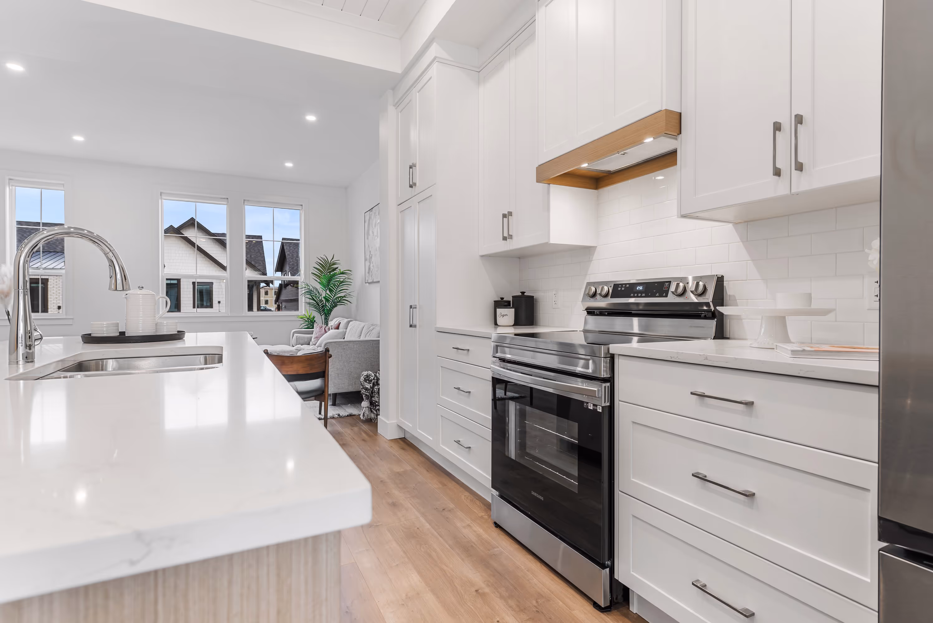 cedarbrook townhome kitchen with light cabinets, stainless steel appliances and light wood accents