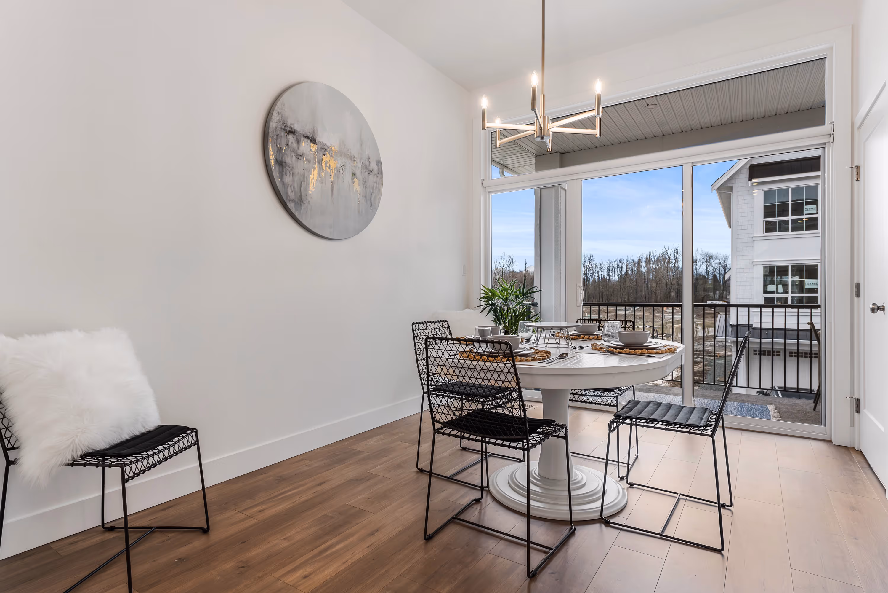 cedarbrook townhome dining room with large window looking out to the deck 