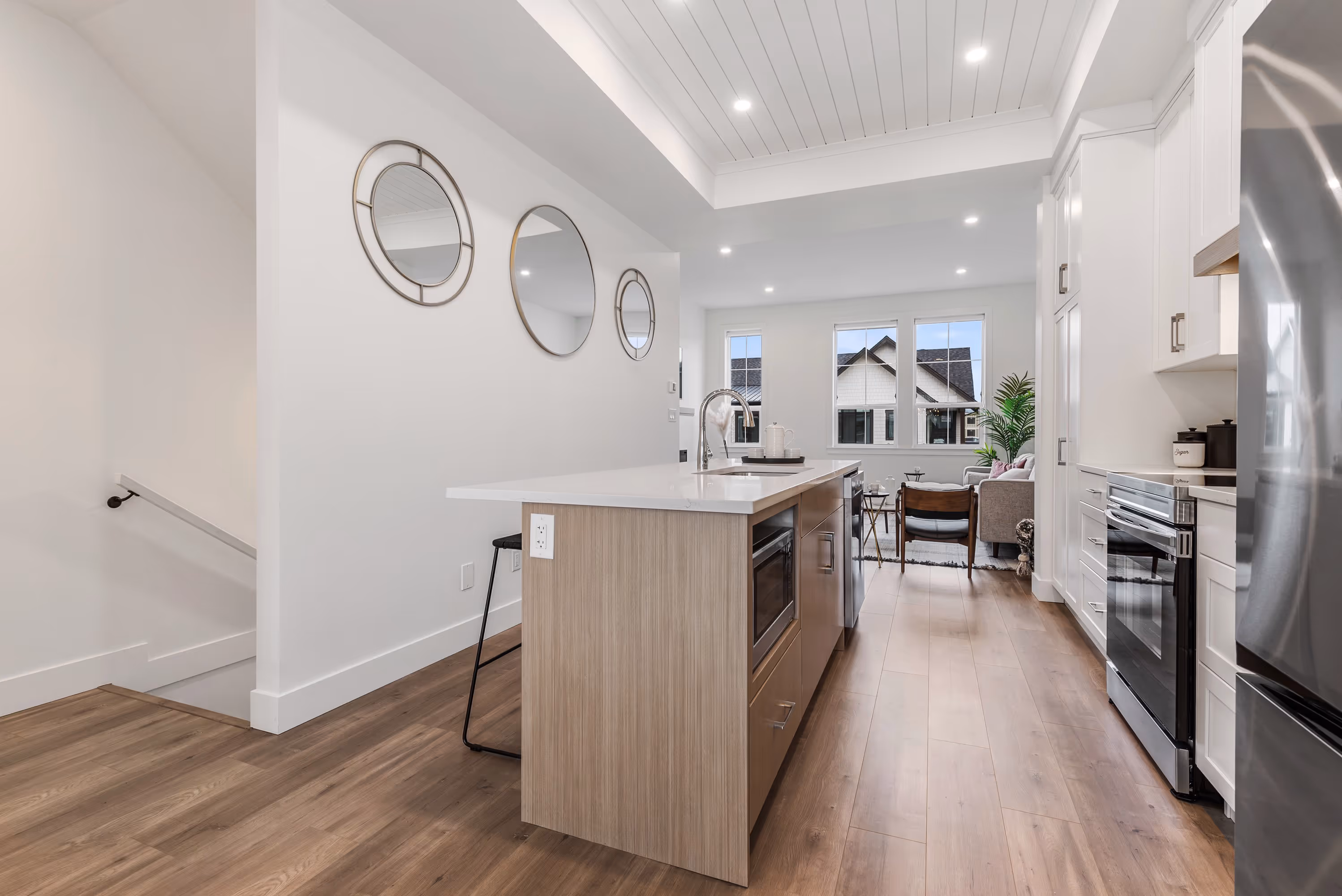 cedarbrook townhome kitchen with stainless steel appliances and light wood accents