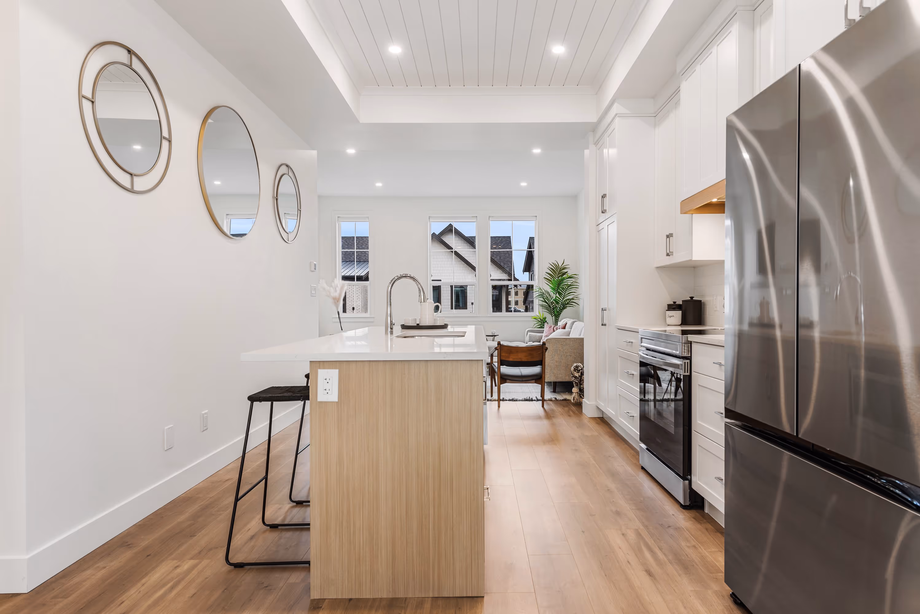 cedarbrook townhome kitchen with stainless steel appliances and light wood accents