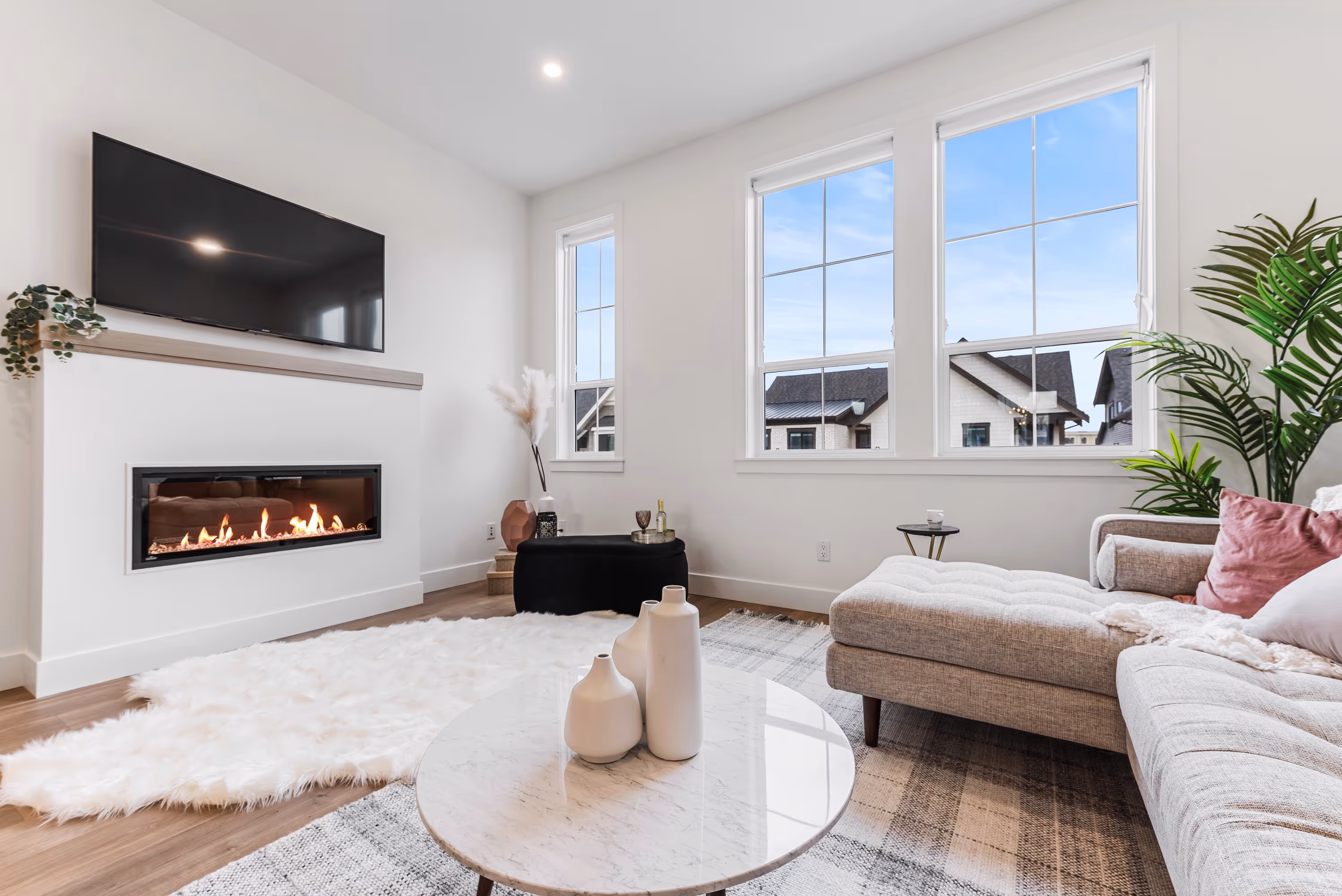 cedarbrook townhome living room featuring a fireplace and mantel with large windows