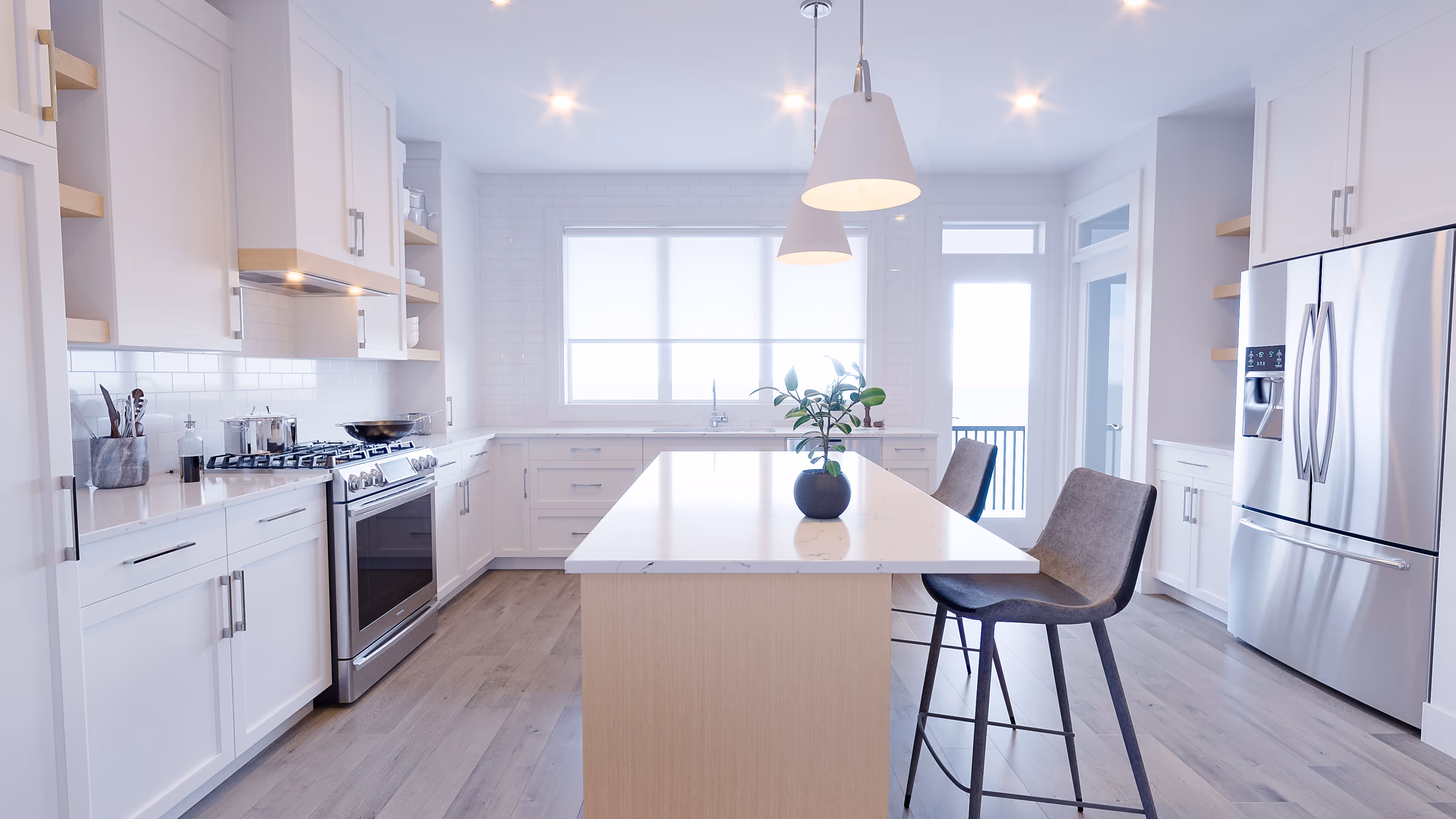 Cedabrook Townhome kitchen featuring the medeira colorway with light wood accents, light coloured cabinets, and stainless steel appliances throughout