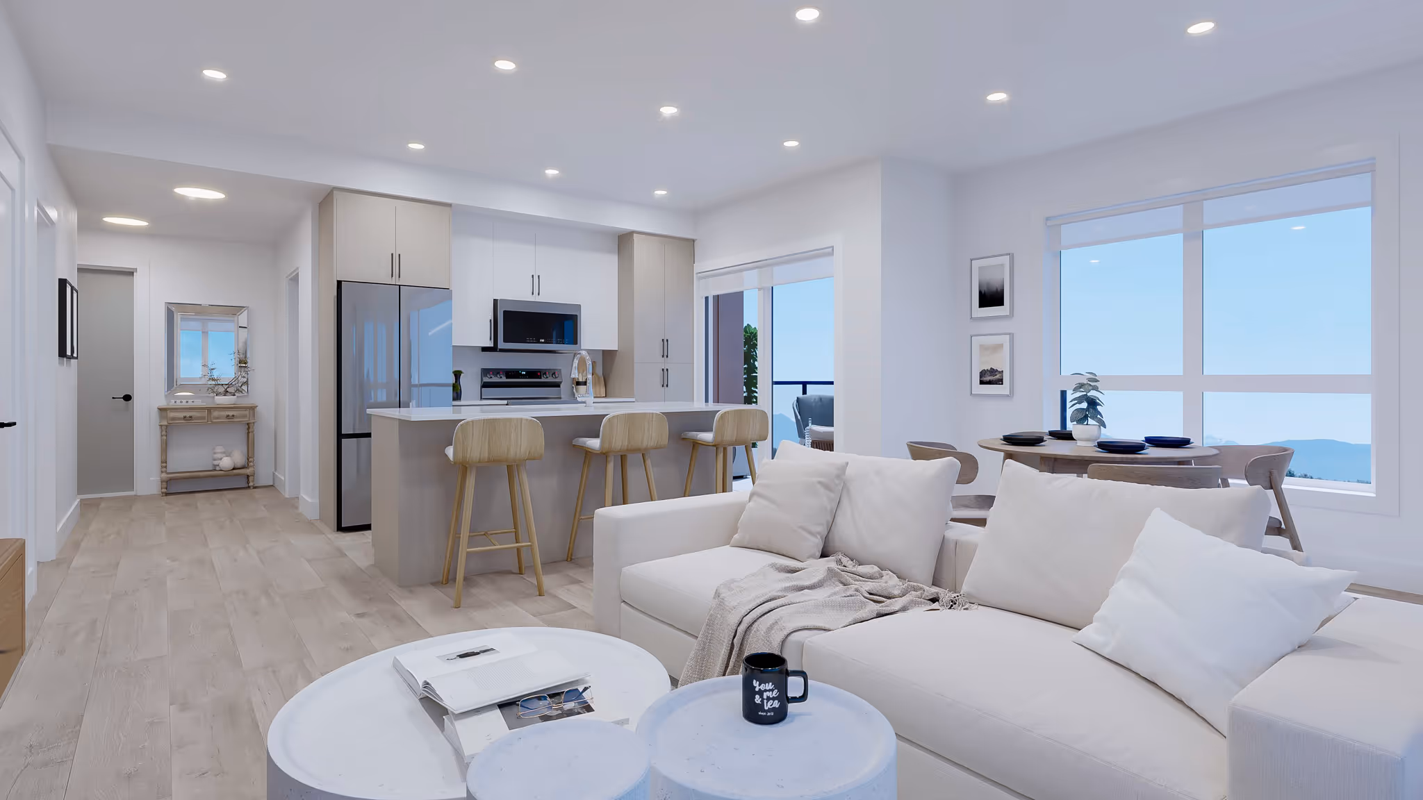Cedarbrook townhome living room with grey sectional couch up against the wall and a small marble coffee table in the center of the room, accompanied by a plaid grey and cream rug