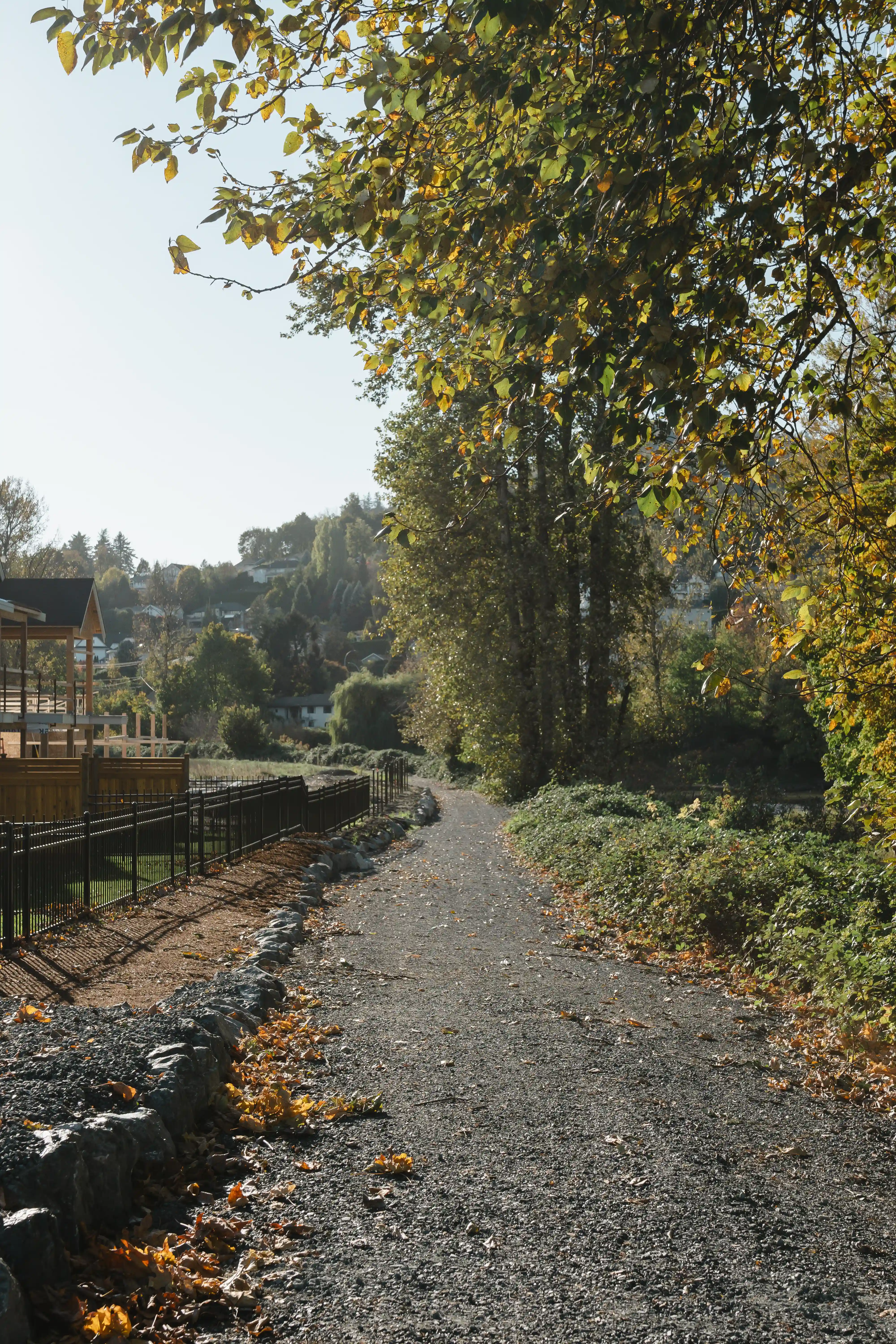 Smiling young couple holding a keyring with several keys in a bright room.