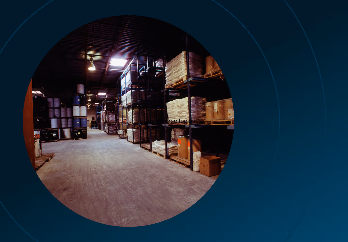 Pallets of barrels and wrapped inventory stacked on shelves in a warehouse