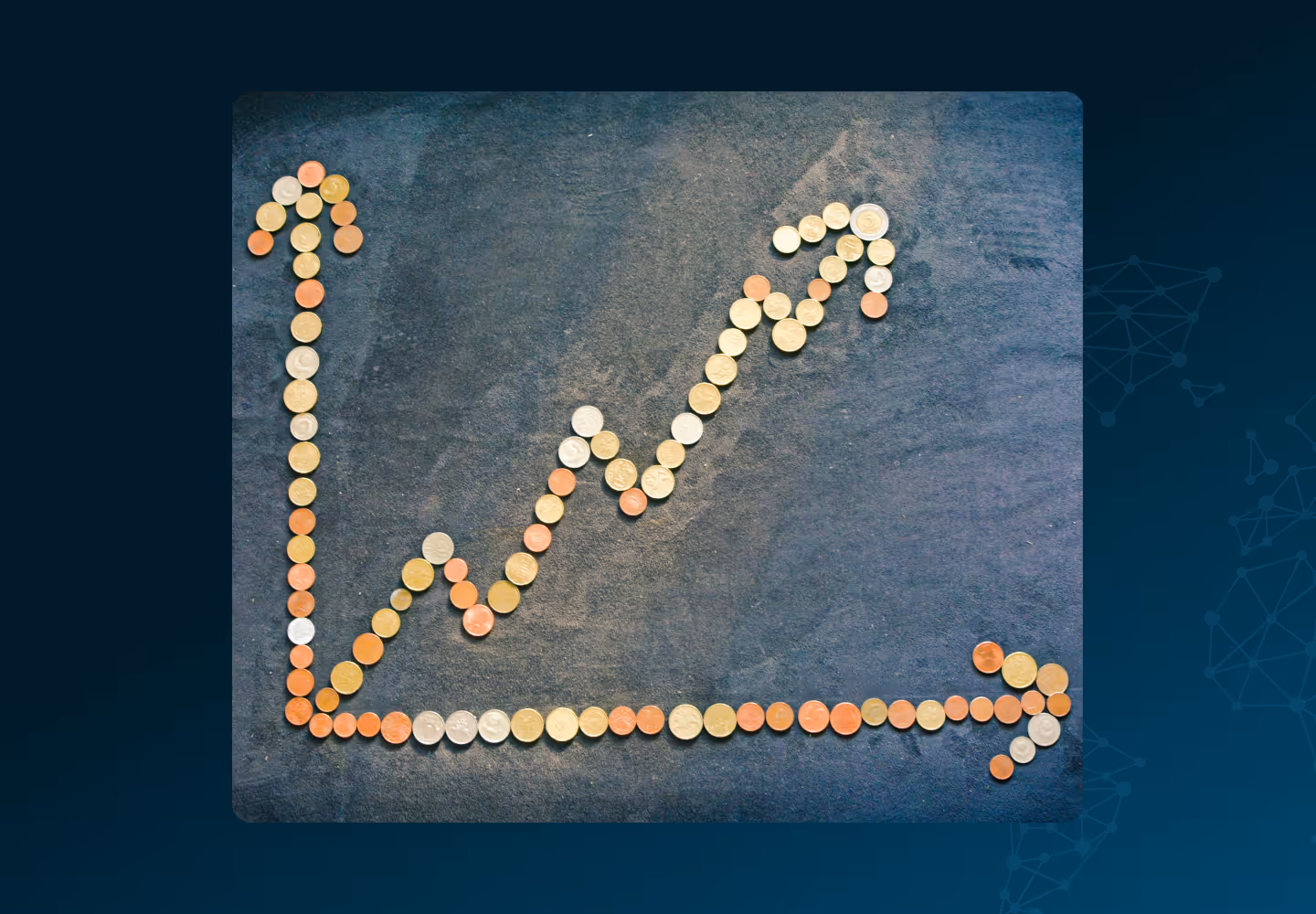 Coins arranged in the shape of an upward-trending graph on a dark slate background