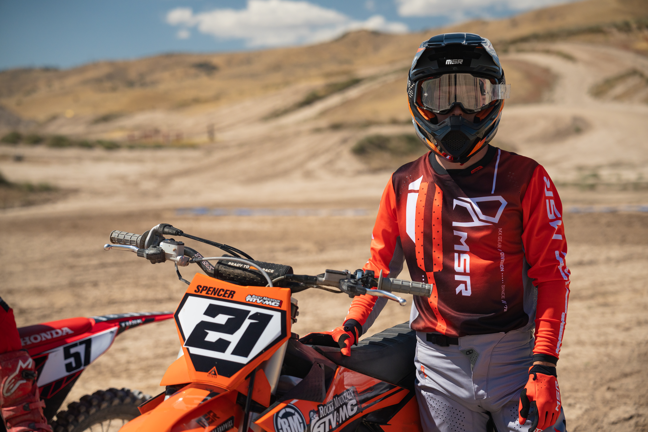 A rider forward facing wearing the maroon preload gear.