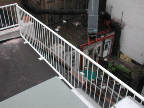 White iron wrought balcony enclosure.