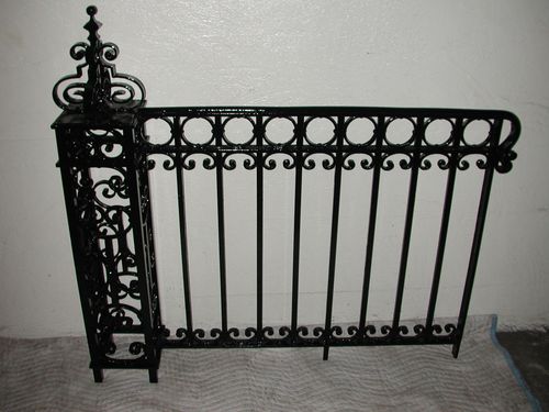 Black iron wrought security fence.